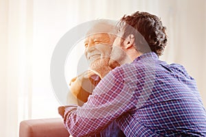 Man kiss elder, son greeting meeting old man for love grandfather in Respect for the Aged Day photo
