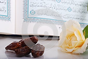 Holy Islam book some dates and rose photo