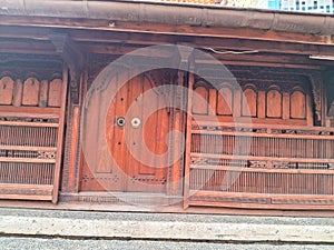 The holy joglo house made of teak wood and carved ornaments from Central Java photo