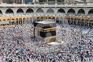 Holy Kaaba. Crowd of people always walking around Kaaba making Tawaf during Hajj. photo