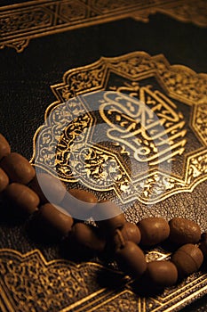 Holy Koran book & rosary photo
