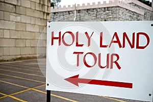 Holy Land tour sign - points left