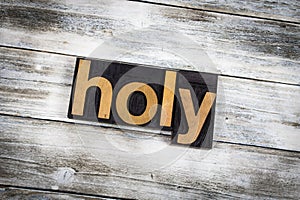 Holy Letterpress Word on Wooden Background