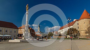 Holy Mary monument on square in front of the Cathedral timelapse and Historic buildings in citycentre in Zagreb, Croatia