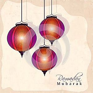 Holy month of Muslim community, Ramadan Kareem celebration with hanging illuminated Arabic lanterns on yellow