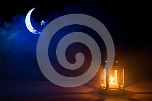 Holy month of Ramadan Kareem. Background with a shining lantern, Crescent Moon and star