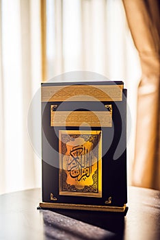 Holy Quran book cover. black and gold design. arabic calligraphy. islamic symbol