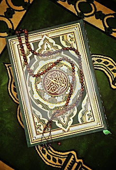 Holy Quran Book With Rosary photo