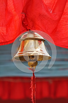 Holy temple bell with colourful backdrop in India