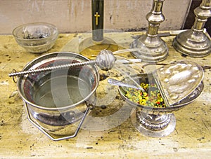 Holy water and fragrant incense ready for the blessing of holy m