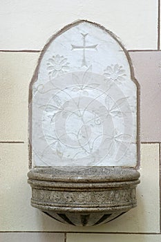 Holy water stoup in the Franciscan church of St. Francis of Assisi in Zagreb