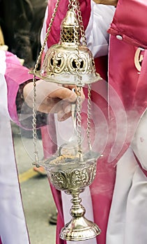 Holy Week in Zamora, Spain. Censer with lit incense during the procession of the Borriquita on Palm Sunday. photo