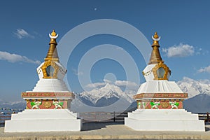 Holy white stupas at Deqing, Yunnan province, China. photo