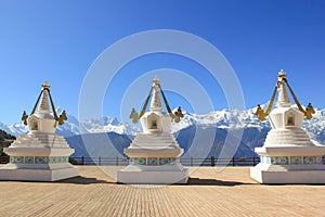 Holy white stupas by Feilai Temple in Deqin
