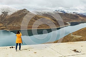 Holy Yamdrok lake and a foreign tourist