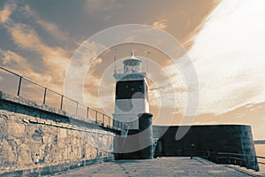 Holyhead Breakwater Lighthouse, on Anglesey in Wales, at the end of a jetty.