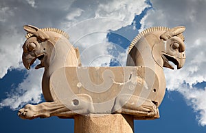 Homa the Griffin Capital Statuary in Persepolis of Shiraz in Iran Against Blue Sky with White Fluffy Clouds