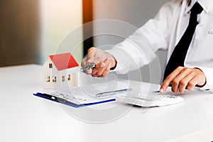 Home agents are sending key to customers signing a contract to buy a new home