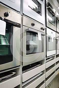 Home appliance store, row of ovens photo