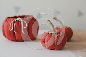 Home autumn decor with cozy fabric pumpkins. Thanksgiving and Halloween concept.