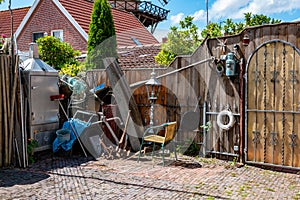 Home backyard with many random tools and gardening objects