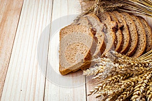 Home baked bread. Rye bakery with crusty loaves and crumbs. Fresh rustic traditional bread with wheat grain ear or spike plant on