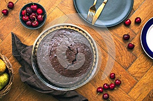 Home baked dark chocolate pie with cweet cherries