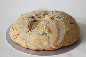 Home baked Irish soda bread with raisins. A quick bread to make at home with out yeast