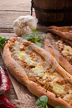 Home-baked pide with green asparagi