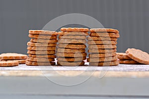 Home baked selfmade dog treat cookies stacked in a row