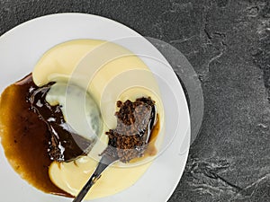 Home Baked Sticky Toffee Pudding Dessert Served With Hot Custard