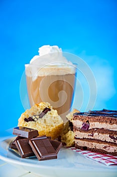 Home baked and tasty sweets on the blue background