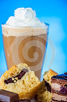 Home baked and tasty sweets on the blue background