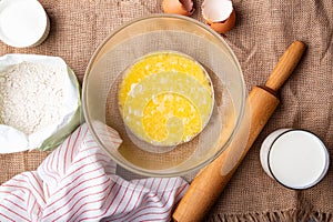 Home Baking - whisking eggs for homemade cake. Rustic recipe with eggs, wholegrain flour, sugar and kefir