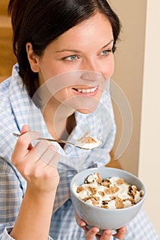 Home breakfast happy woman pajamas eating cereals