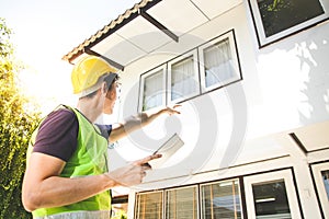 The home builder carries a tablet to check the finish before handing it over to the landlord.