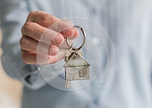 Home buyer or apartment sale agent giving key for leasing, security and ownership concept