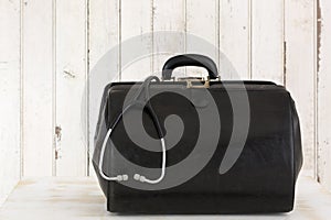 Home call, doctor's bag with stethoscope