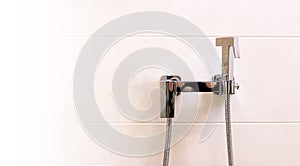home chrome shower bidet for bathroom toilet, modern apartment style, close-up
