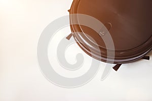 Home cleaning robot. Close-Up Of Autonomous Robot On White Background