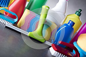 Variety cleaning products on gray background.