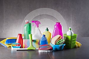 Variety cleaning products on gray background.