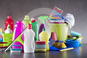 Variety cleaning products on gray background.