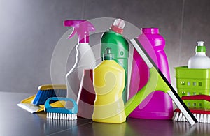 Variety cleaning products on gray background.