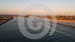 Home coming of fleet of fishing boats at sunset in San Diego