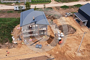 Home construction of ceramsite blocks. Construction site of the building a country houses. Suburb house construction concept.