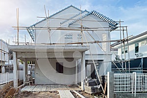 Home during construction on site with bamboo scaffolding image for property businessinvestment and construction industry