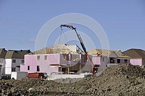 Home construction site with crane