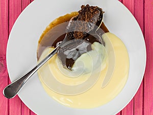 Home Cooked Sticky Toffee Pudding Dessert Served With Hot Custard