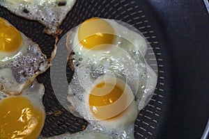 Home cooking. Fried quail eggs in frying pan